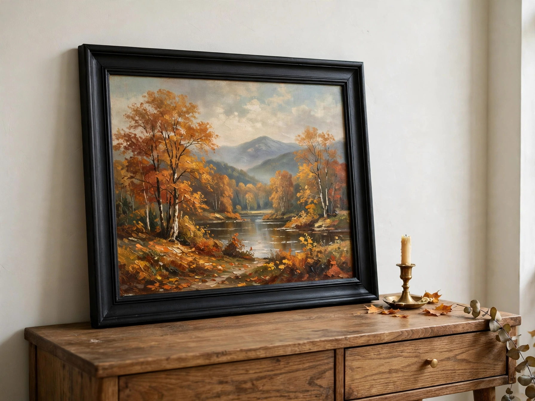Thrifted fall landscape painting in a repainted modern frame