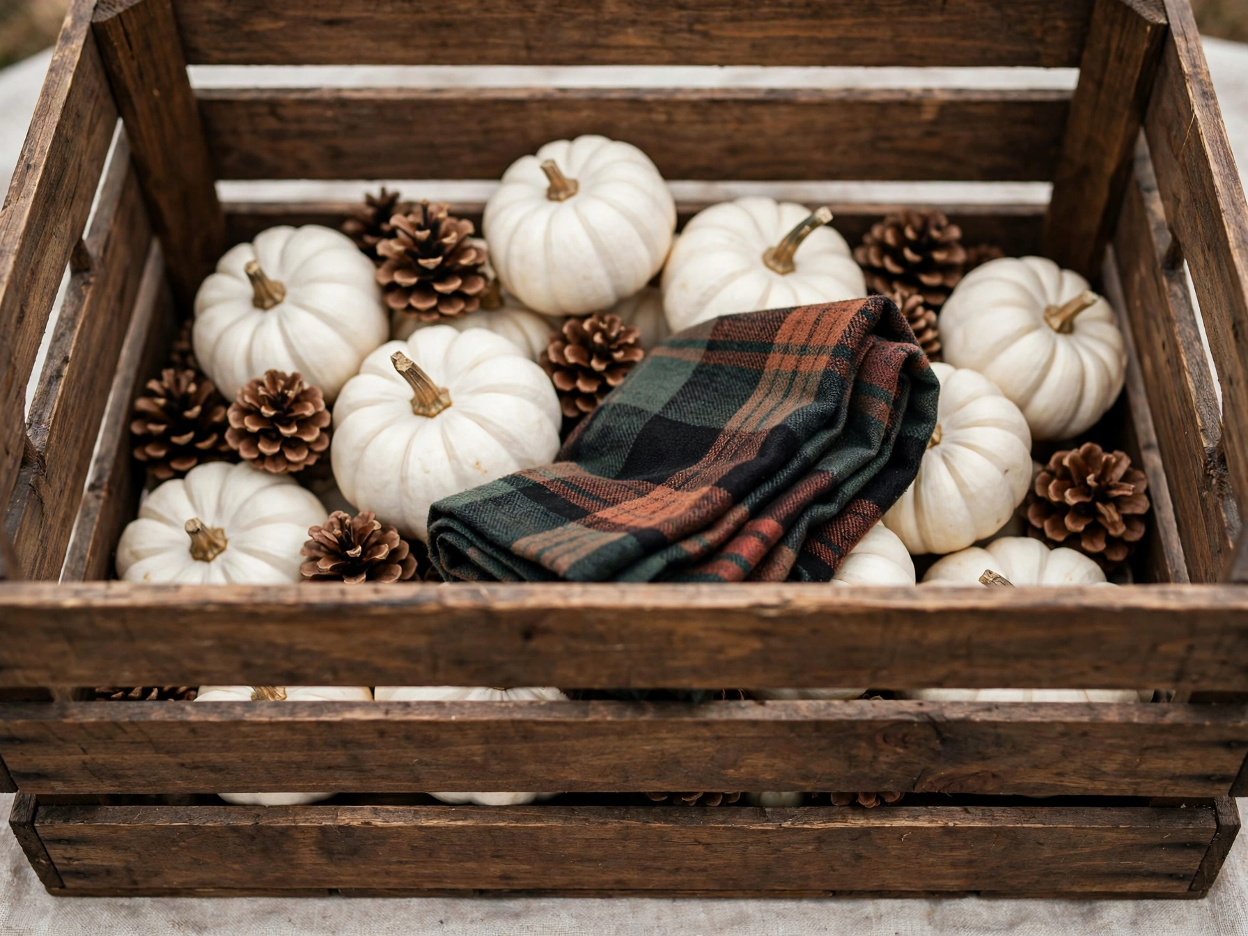 Walnut-stained crate with mini pumpkins and pinecones