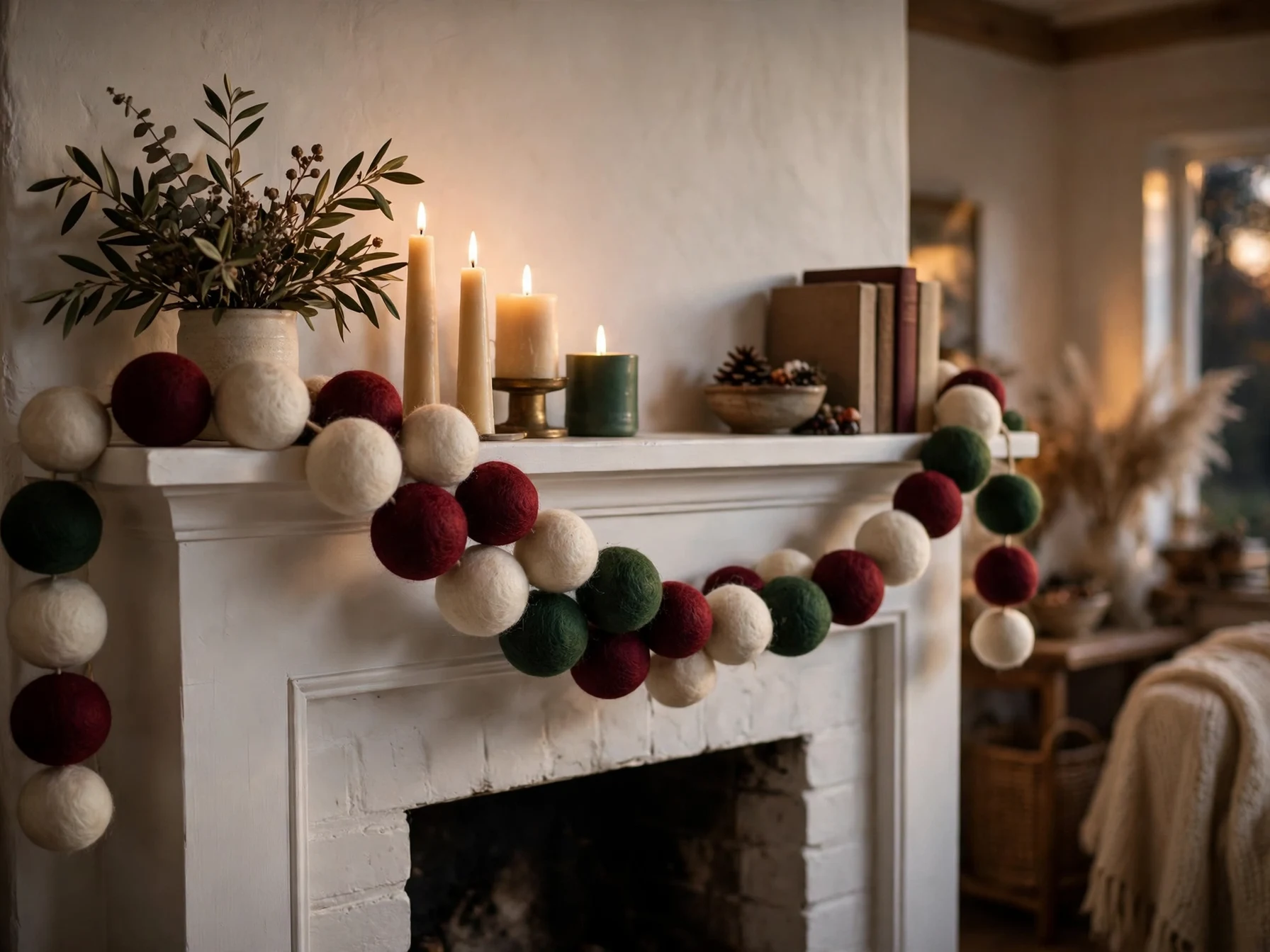 colorful felt ball christmas garland draped on a mantel